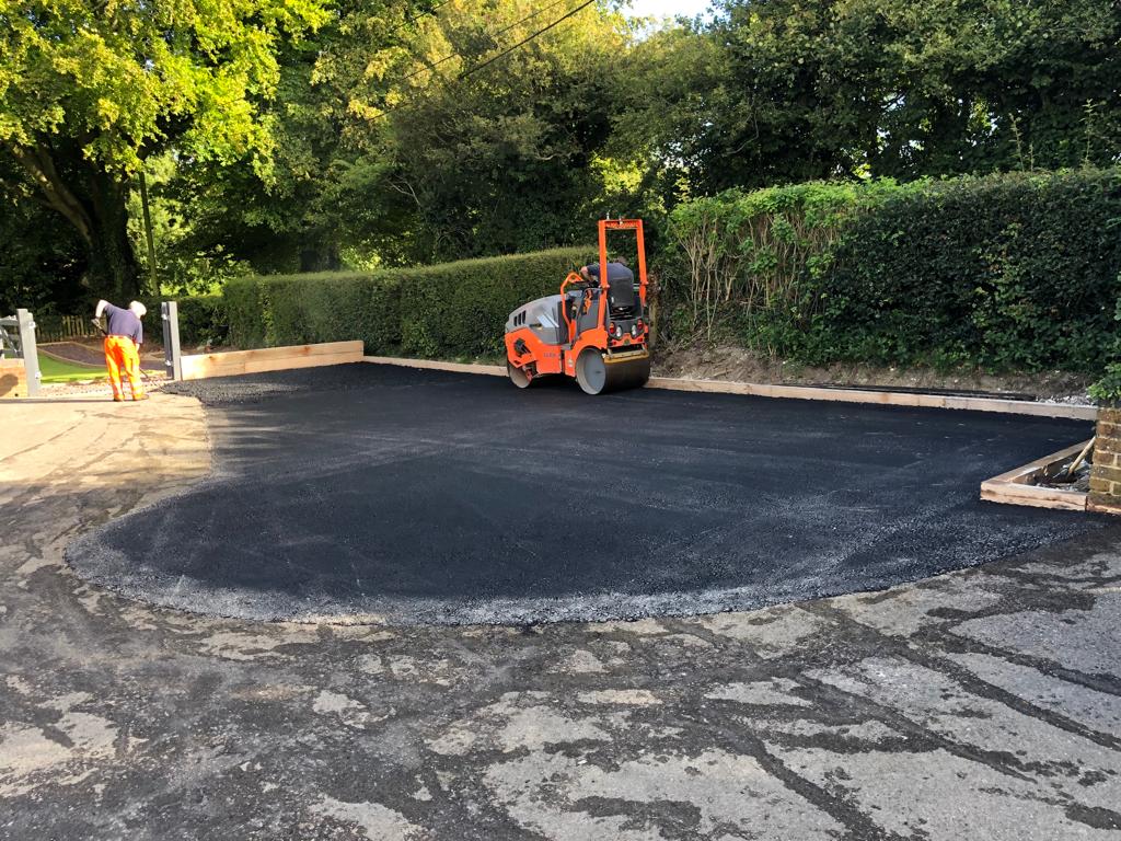 This is a photo of a bitumen driveway which is in the process of being installed by Nerang Surfacing Solutions